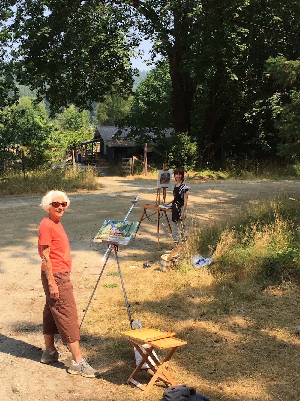 Tweaking a plein air painting in the studio: Dad snapped a photo of me and Mum at work. (Mum was working at watercolour.)