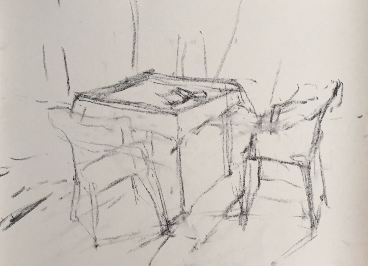 Chaos of Light And Shadow: 2. A quick placement of the main items of table and chairs, trying to get at least some correctness of perspective. Vine charcoal on UART 400.