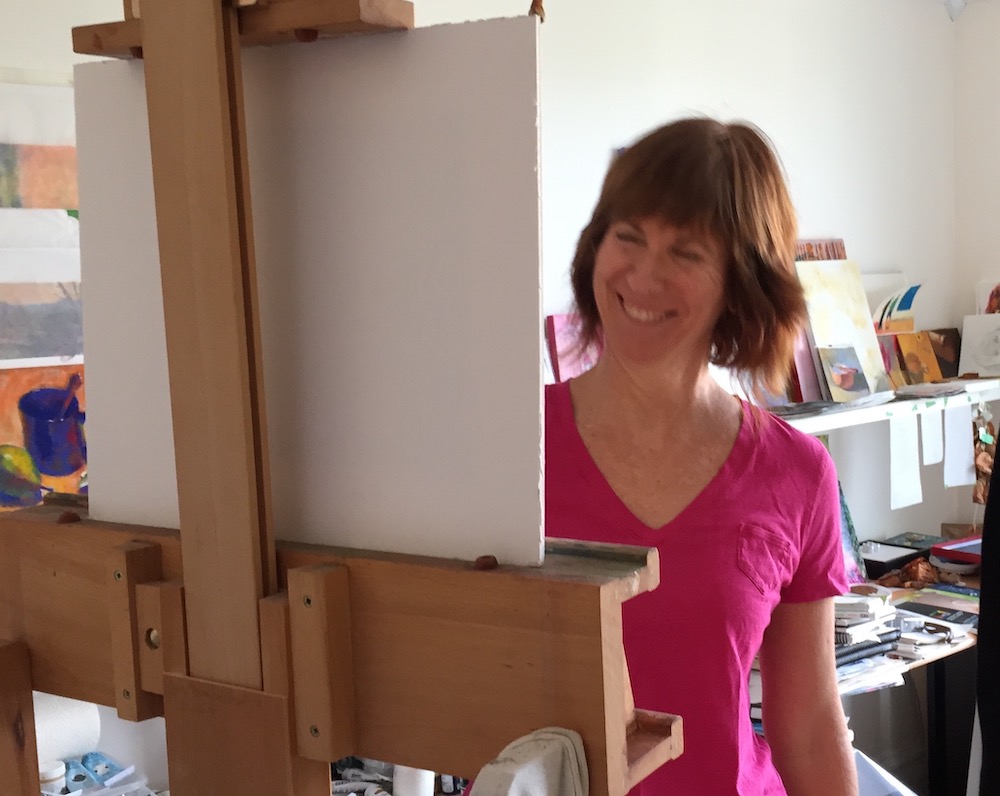 Gail at her easel -an easel seen from the back