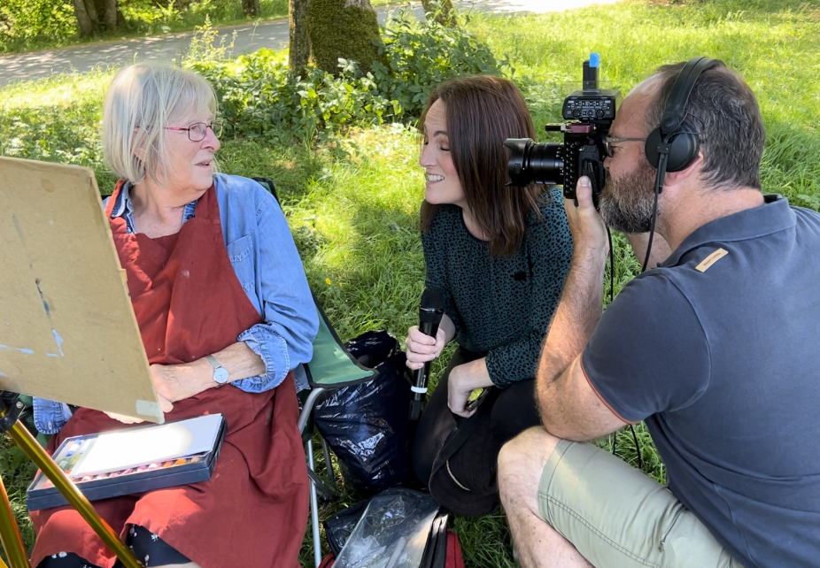 Painting in the Yorkshire Dales - Pat being interviewed by Channel Five about the sale of Kilnsey Crag.